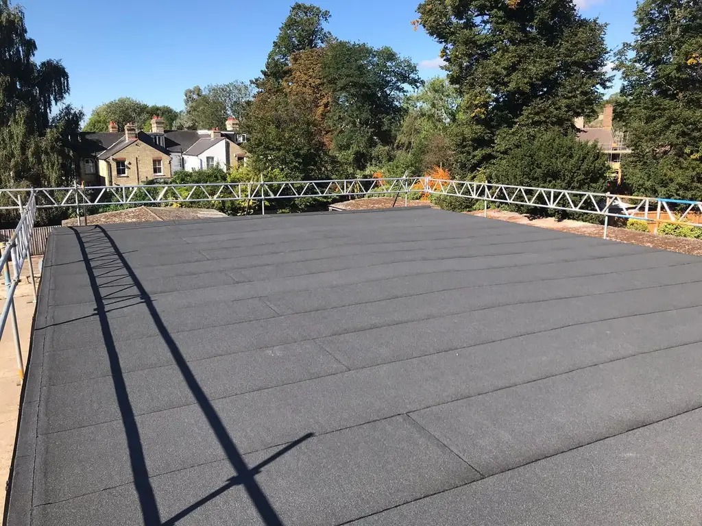 Flat roof covering being laid by Carl Dunn Building & Roofing, Cambridge