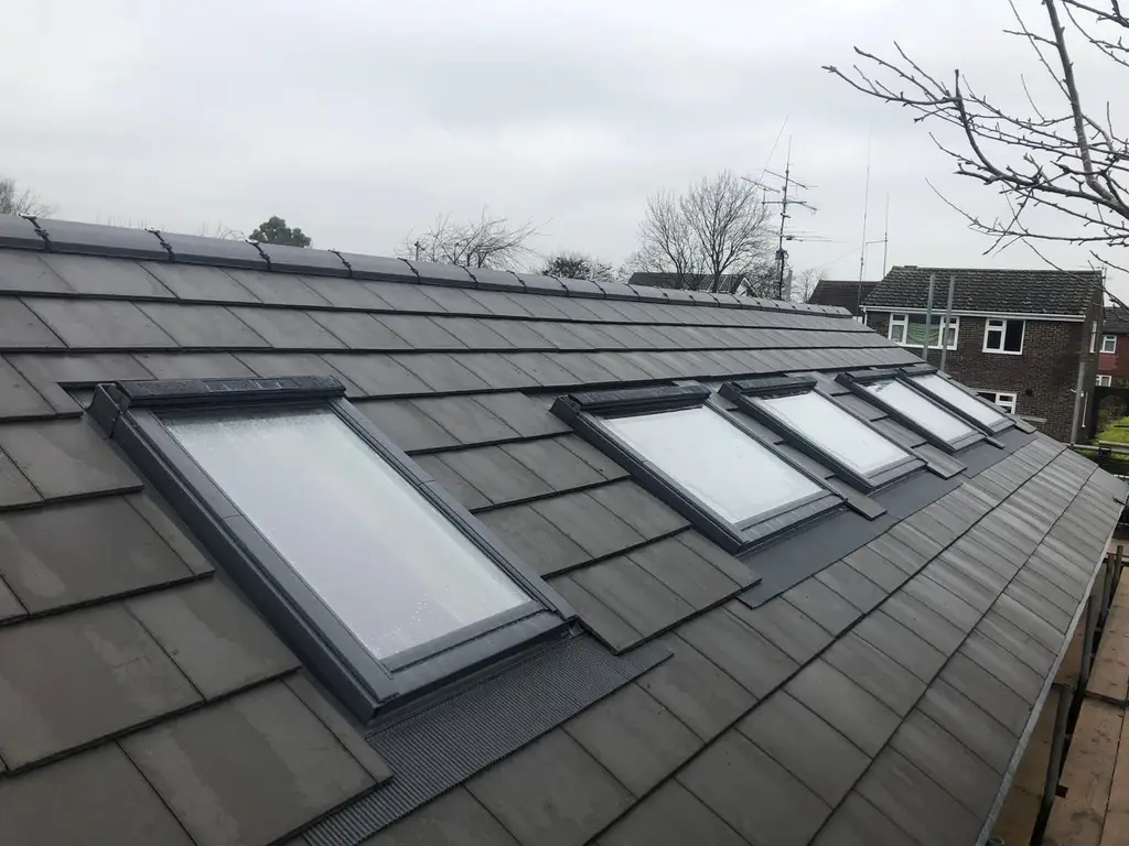 Four roof windows fitted in a row by Carl Dunn Building & Roofing, Cambridge