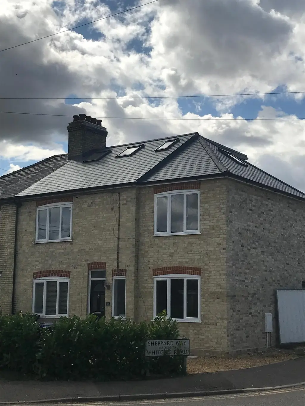 Hip to gable loft conversion with slate roof and roof windows by Carl Dunn Building & Roofing, Cambridge
