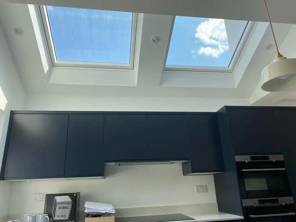 Kitchen with flat roof lights overhead by Carl Dunn Building & Roofing, Cambridge