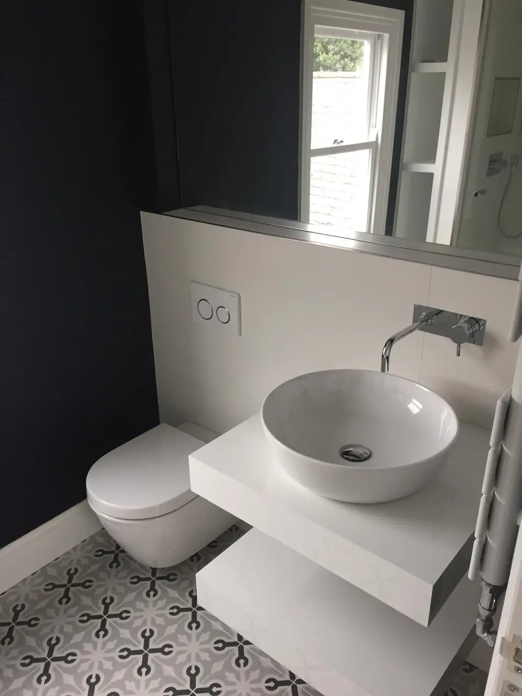 Modern bathroom with vessel basin and wall-hung WC by Carl Dunn Building & Roofing, Cambridge