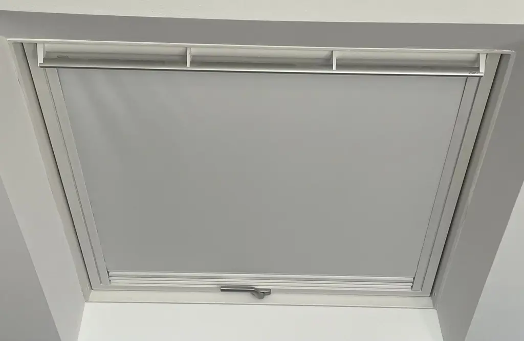 Roof window with blackout blind fitted by Carl Dunn Building & Roofing, Cambridge