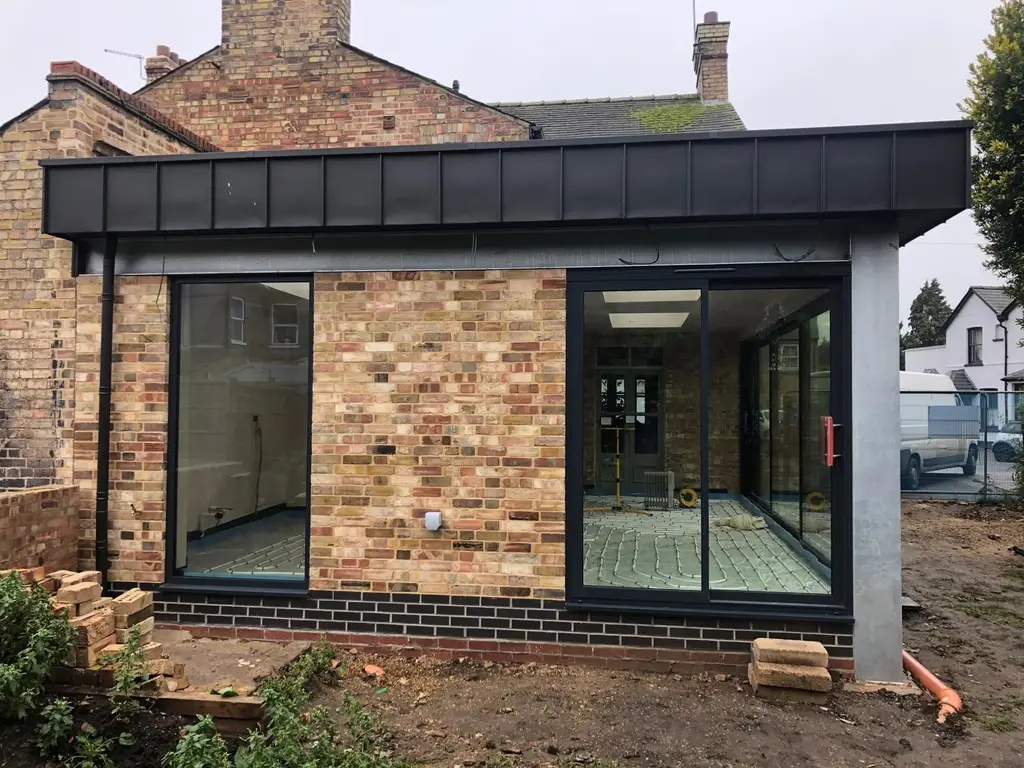 Single storey rear extension with standing seam fascia by Carl Dunn Building & Roofing, Cambridge