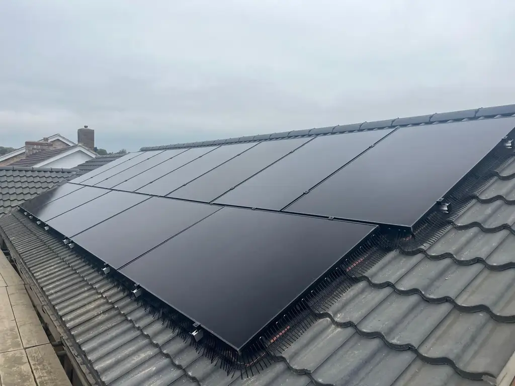 Solar panels fitted on a new tiled roof by Carl Dunn Building & Roofing, Cambridge